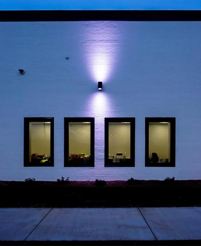 Architectural-&-Facade Cylinder facade light on a building exhibiting MicroVOS optics