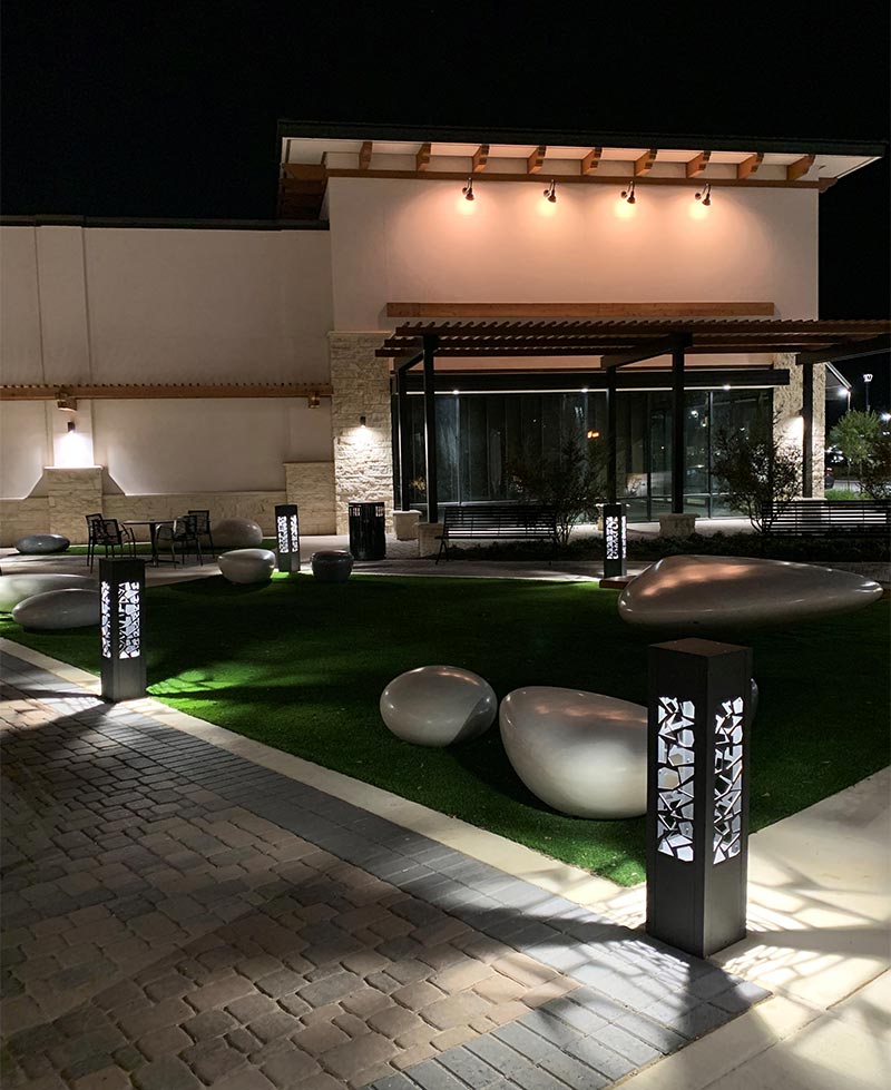 Mixed-Use-Developments Custom lit bollards outside of a mixed-use development