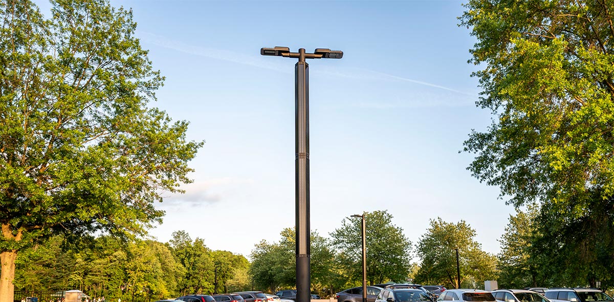 A Zenith solar streetlight standing in a parking lot